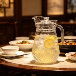 BY-9162B-1 unbreakable PC water pitcher - on a restaurant table
