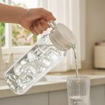 BY-9141C unbreakable PC water pitcher - being poured by hand