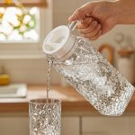 BY-9143 unbreakable PC water pitcher - being poured by hand