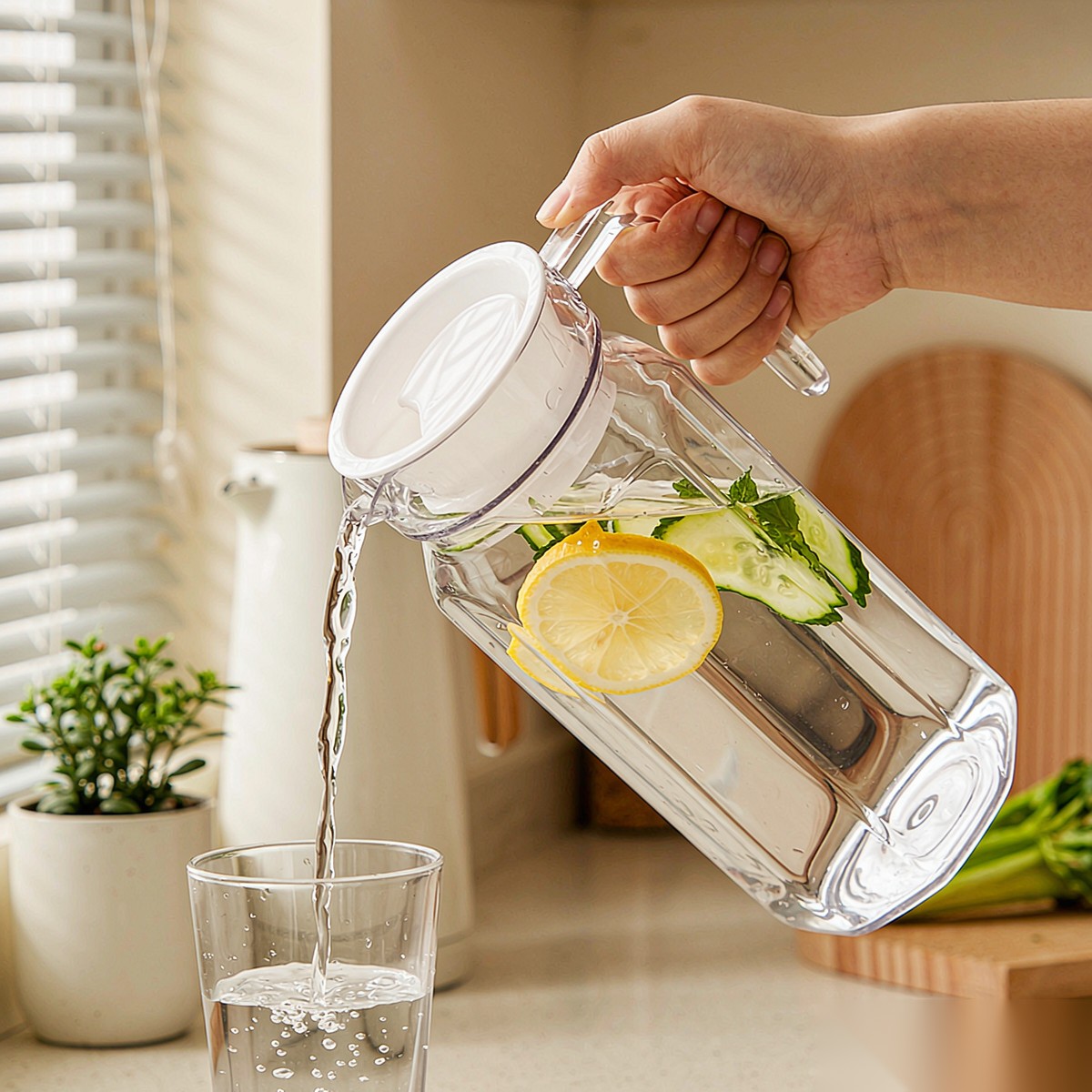 BY-9144A unbreakable PC water pitcher - being poured by hand