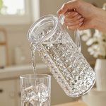 BY-9165 unbreakable PC full-handle water pitcher - being poured by hand