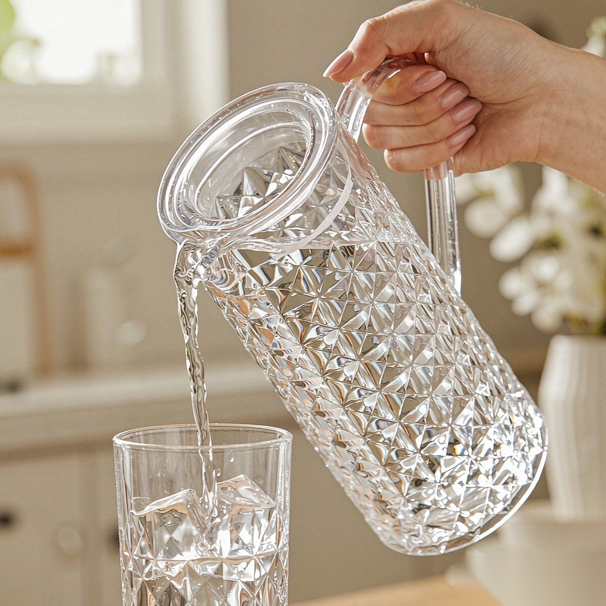 BY-9165 unbreakable PC full-handle water pitcher - being poured by hand