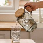 BY-9195B unbreakable PC full-handle water pitcher (gray) - being poured by hand