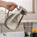 BY-9197B unbreakable PC full-handle water pitcher (gray) - being poured by hand