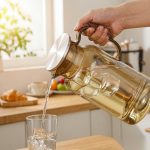 BY-9198A unbreakable PC full-handle water pitcher (tea) - being poured by hand