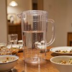 BY-8553 unbreakable PC full-handle water pitcher - set on a dining table for dinner