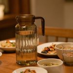 BY-9141C unbreakable PC water pitcher (tea) - set on a dining table for dinner