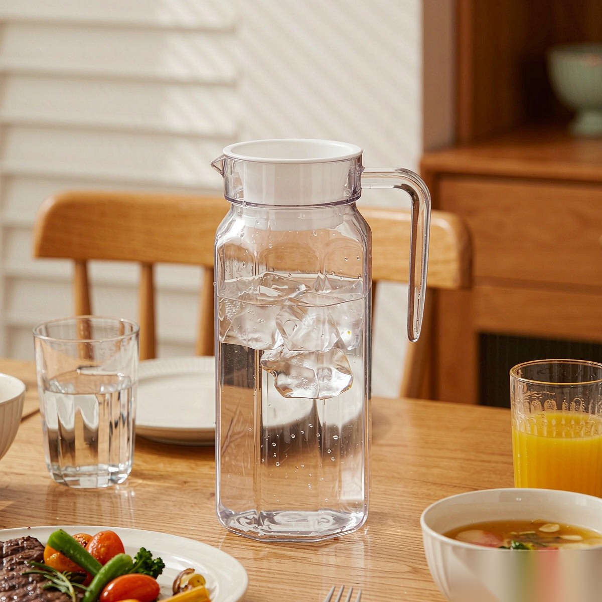 BY-9144A unbreakable PC water pitcher - set on a dining table for dinner