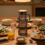 BY-9160C unbreakable PC stainless steel handle water pitcher (gray) - set on a dining table for dinner