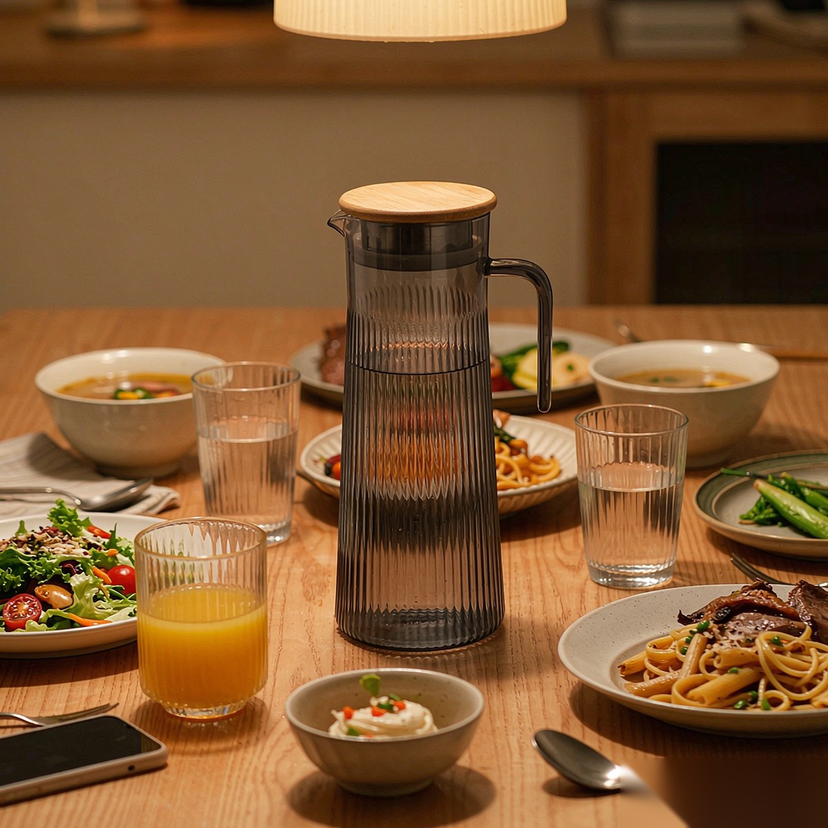 BY-9160C unbreakable PC stainless steel handle water pitcher (gray) - set on a dining table for dinner
