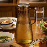 BY-9191A unbreakable PC full-handle water pitcher (tea) - set on a dining table for dinner