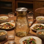 BY-9192B unbreakable PC full-handle water pitcher (tea) - set on a dining table for dinner