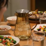 BY-9192C unbreakable PC full-handle water pitcher (tea) - set on a dining table for dinner