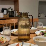 BY-9195A unbreakable PC full-handle water pitcher (tea) - set on a dining table for dinner