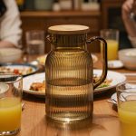 BY-9195C unbreakable PC full-handle water pitcher (tea) - set on a dining table for dinner