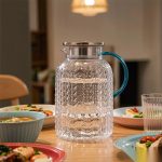 BY-9196A unbreakable PC full-handle water pitcher (steel) - set on a dining table for dinner