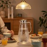 BY-9197A unbreakable PC full-handle water pitcher (steel) - set on a dining table for dinner