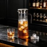BY-9160B-1 unbreakable PC stainless steel handle water pitcher - on a black marble bar counter