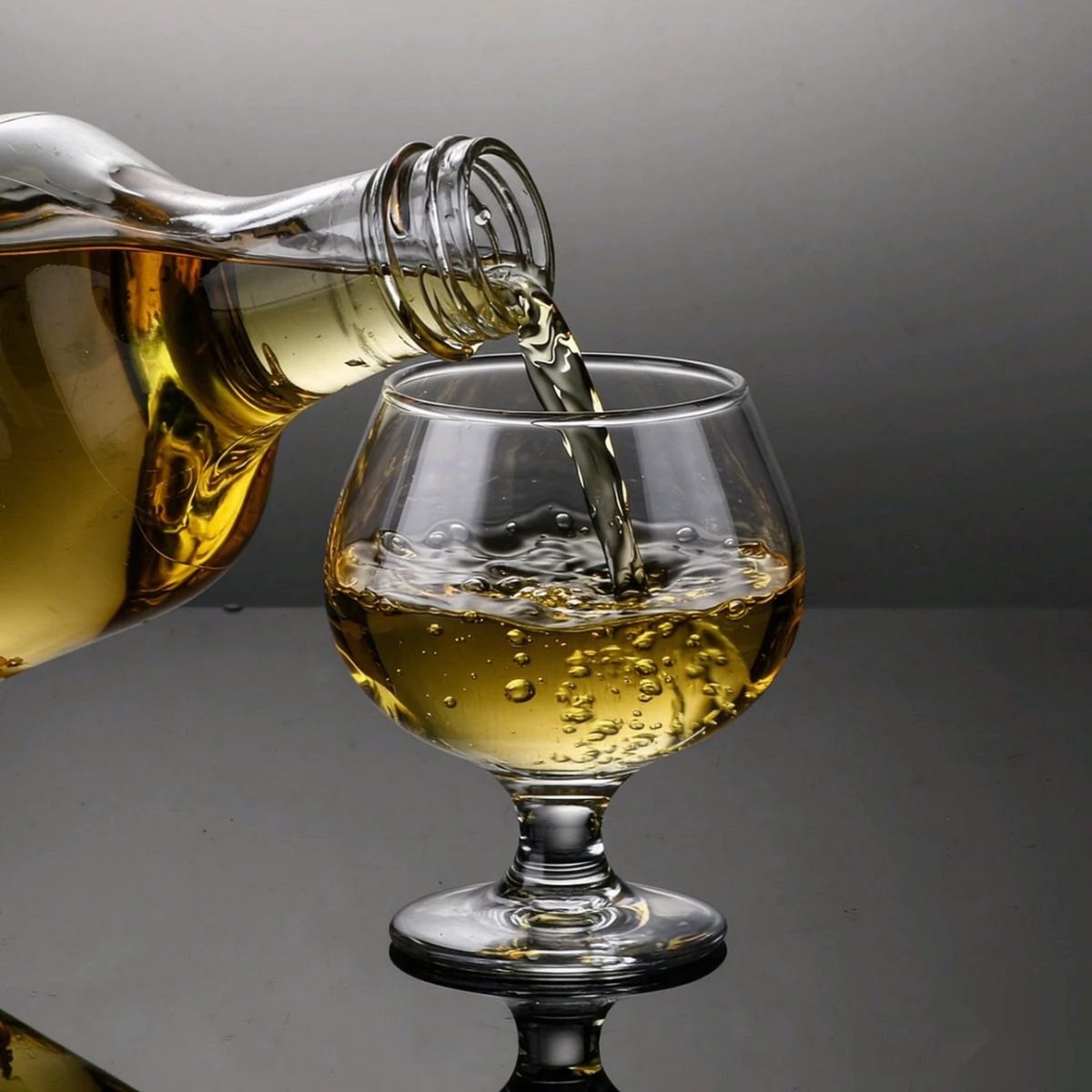 BY-9912F PC brandy snifter in pouring action shot