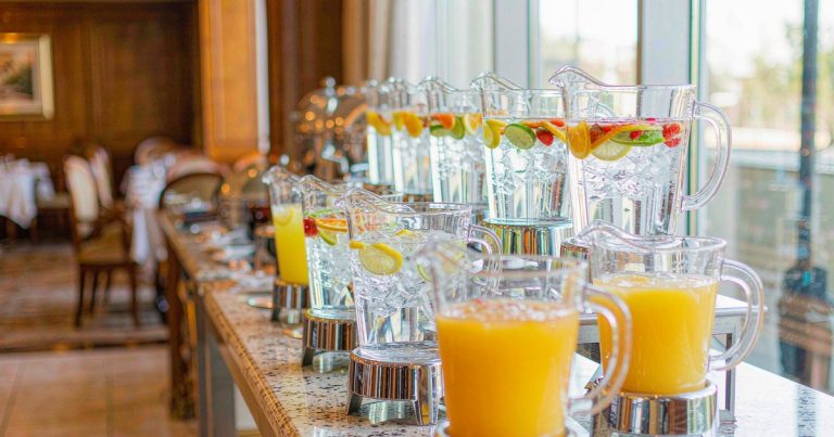 Unbreakable PC water pitchers on a hotel breakfast buffet - wholesale polycarbonate carafes and juice pitchers